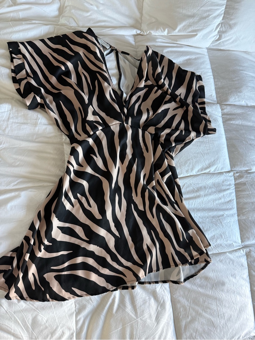 Sleeveless Zebra-Print Mini Dress in Black and Beige